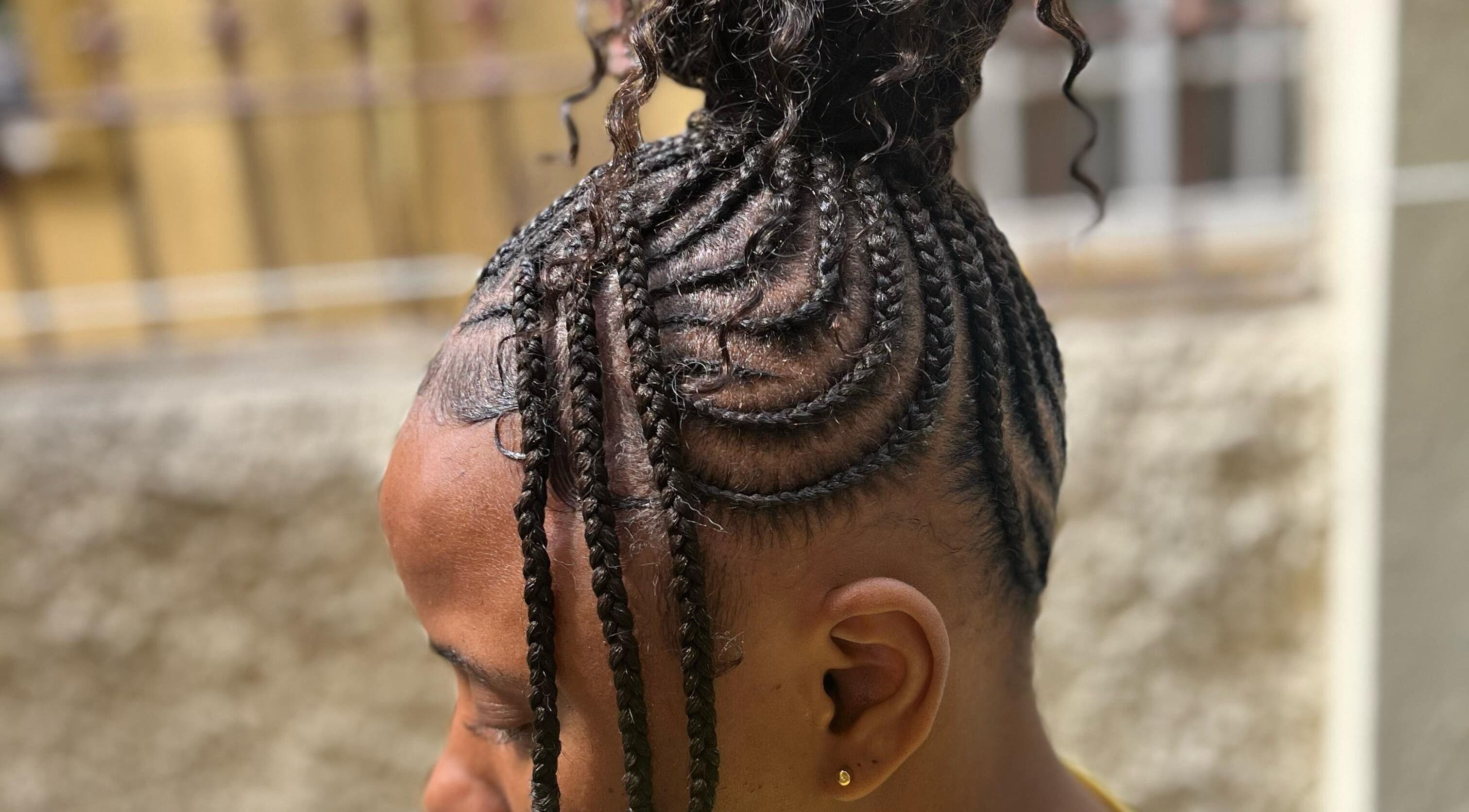 Intricate braided hairstyle at Tressed_bybrit, Montego Bay, St. James Parish, JM highlights unique styling.