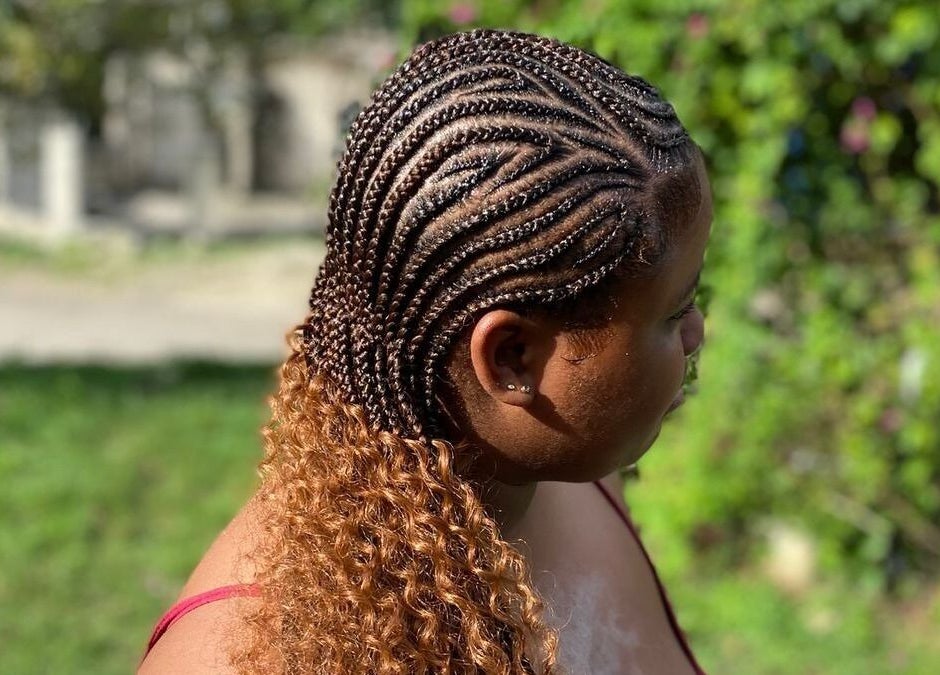 Intricate cornrow braids blending into curls at Tressed_bybrit, Montego Bay, St. James Parish, JM.