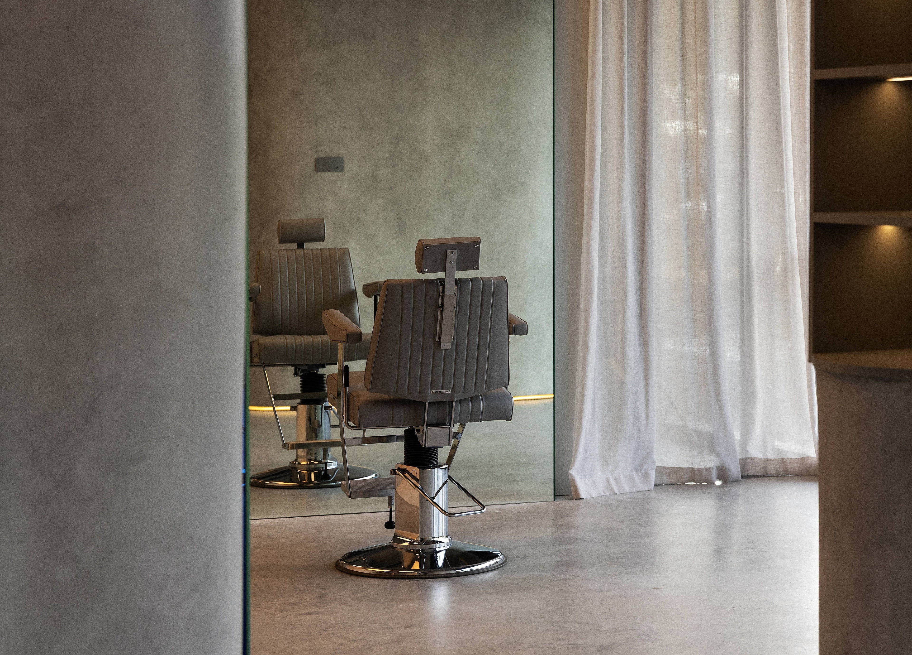 Modern salon chair at Alkami in Belconnen, Australian Capital Territory, AU, ideal for a relaxing beauty experience.