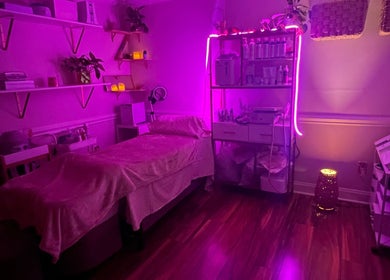 Ambient purple-lit treatment room at B&G Wellnes Salon in Roswell, Georgia, US.