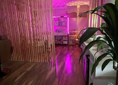 Inviting, softly lit interior of B&G Wellness Salon in Roswell, Georgia, US, showcasing a tranquil ambiance.
