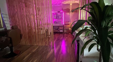 Inviting, softly lit interior of B&G Wellness Salon in Roswell, Georgia, US, showcasing a tranquil ambiance.