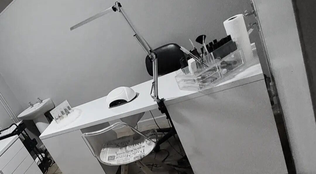 Nail salon workspace at C C Beauty Aesthetics, Pretoria, Gauteng, ZA, featuring manicure tools and ergonomic chair.