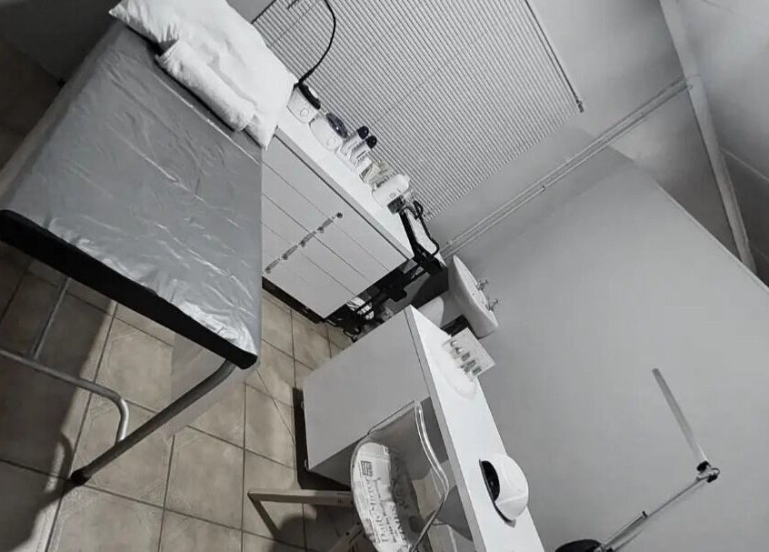 Calm treatment room at C C Beauty Aesthetics in Pretoria, Gauteng, ZA, featuring a treatment bed and white furnishings.