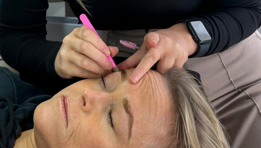Enhance Beauty expert shaping eyebrows at Albion Park Rail, New South Wales, AU.