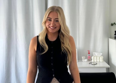 A friendly professional at Enhance Beauty, Albion Park Rail, New South Wales, AU, ready to assist clients.