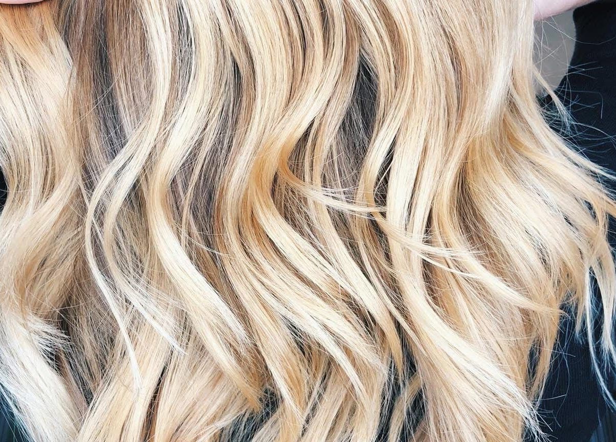 Blonde wavy hair styled at Kelly Hair Studio inside Green Cactus cafe, London, England, GB.