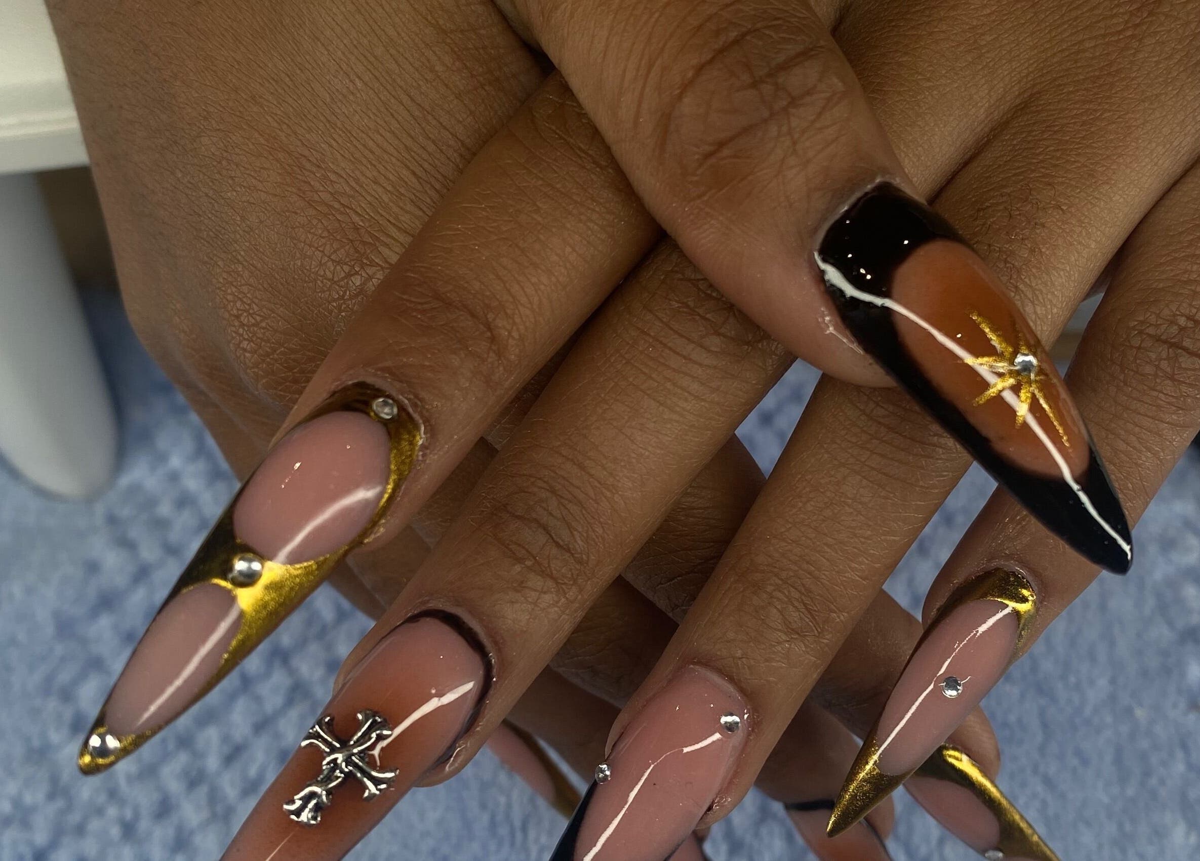 Elegant nail art with black and gold design at Playful and Polished, Randburg, Gauteng, ZA.