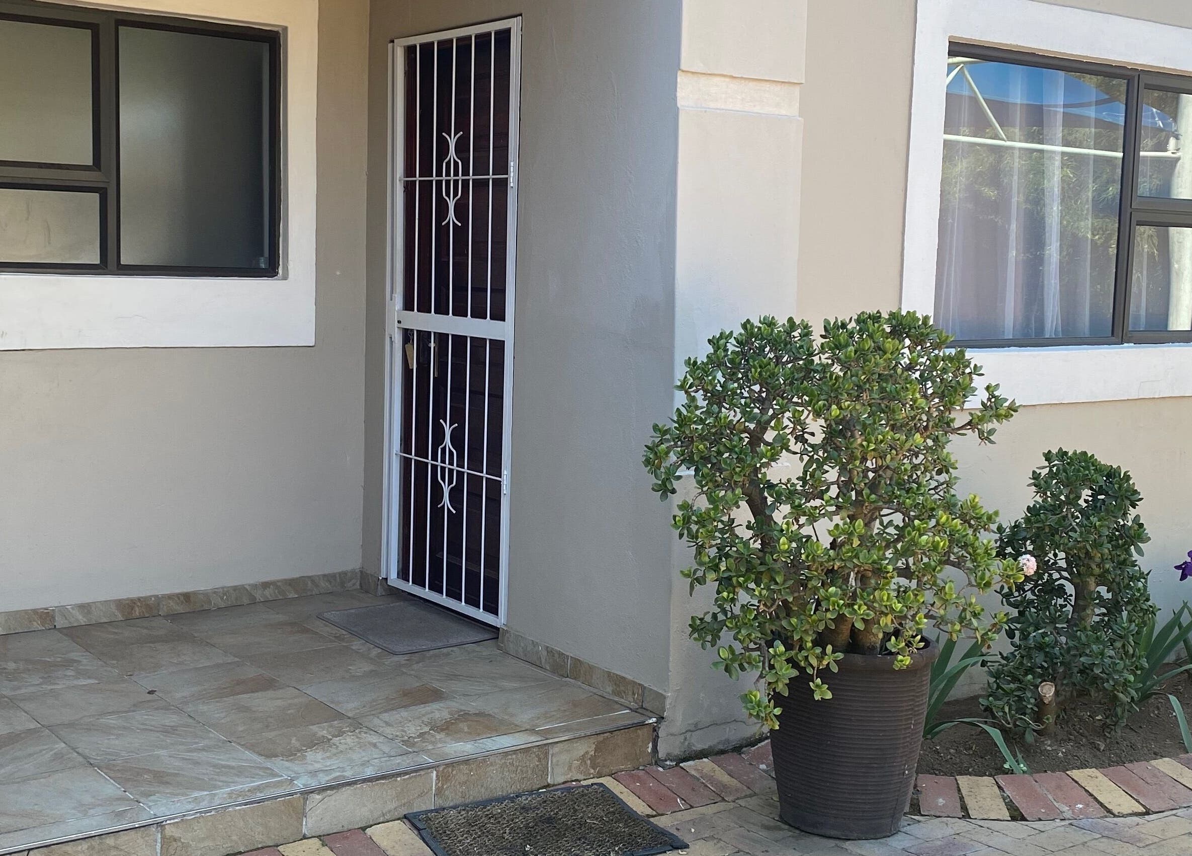 Front entrance of Playful and Polished, featuring a chic tiled area in Randburg, Gauteng, ZA.