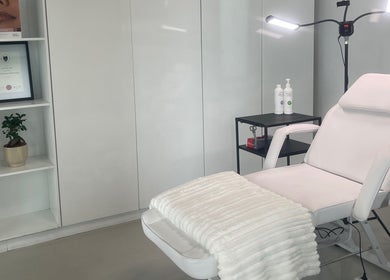 Calm treatment room at Dr. Allison Aesthetics, Cape Town, Western Cape, ZA featuring a plush recliner.