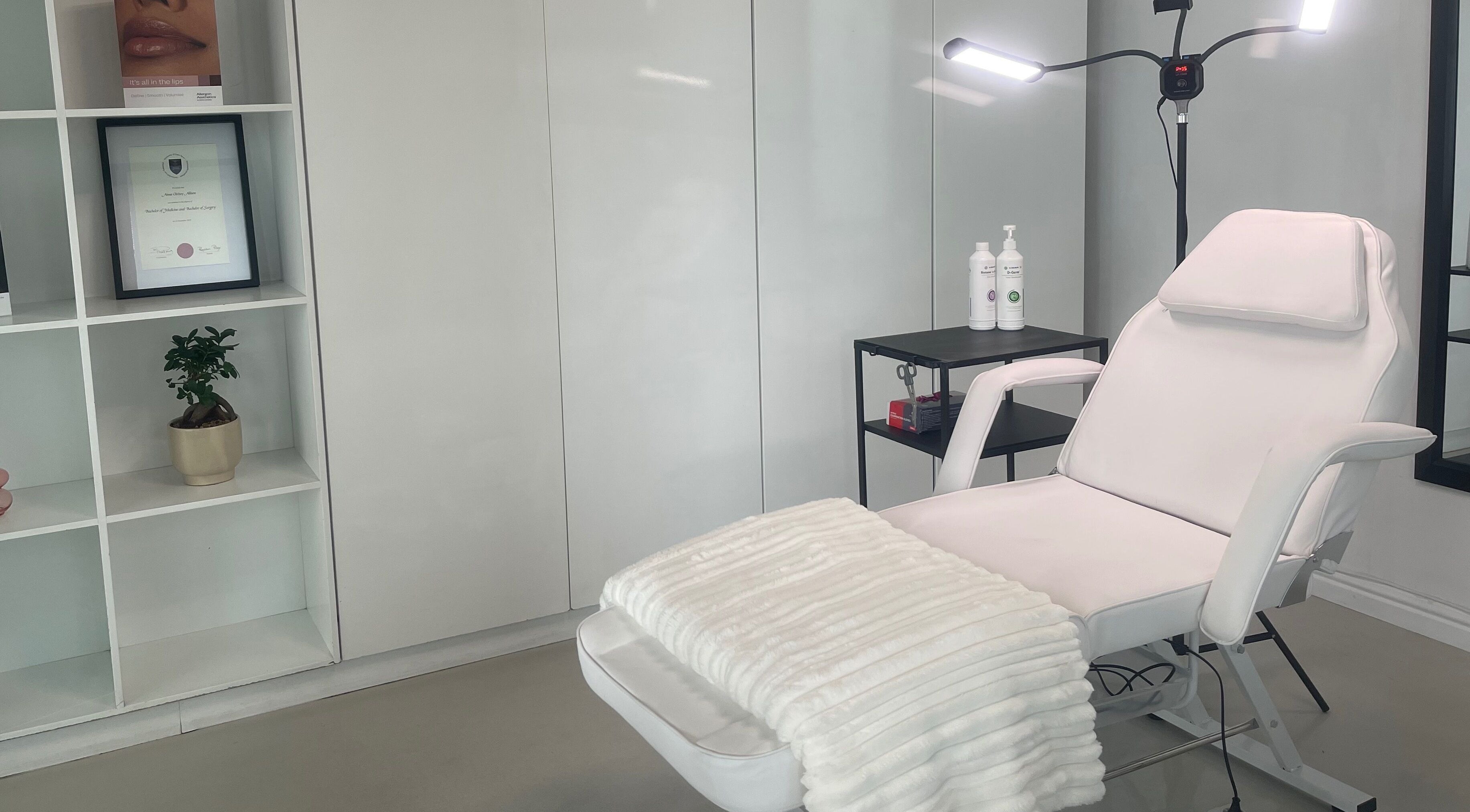 Calm treatment room at Dr. Allison Aesthetics, Cape Town, Western Cape, ZA featuring a plush recliner.