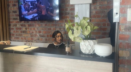 Reception desk with a staff member at Dr. Allison Aesthetics in Cape Town, Western Cape, ZA.