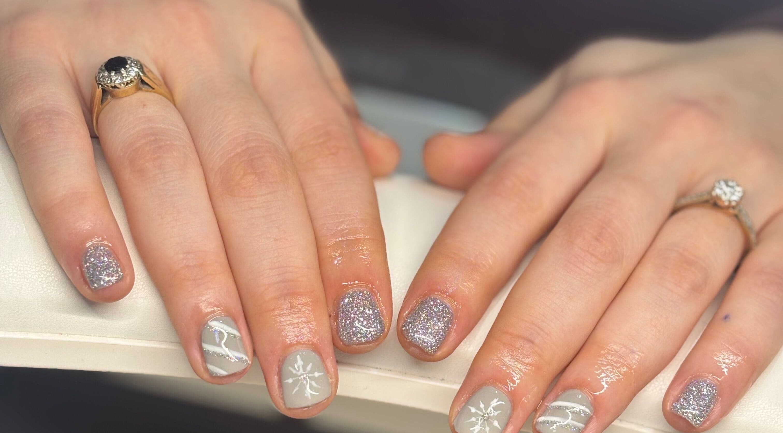 Elegant silver nail art at By Ells, Redditch, England, GB showcasing trendy sparkle design.