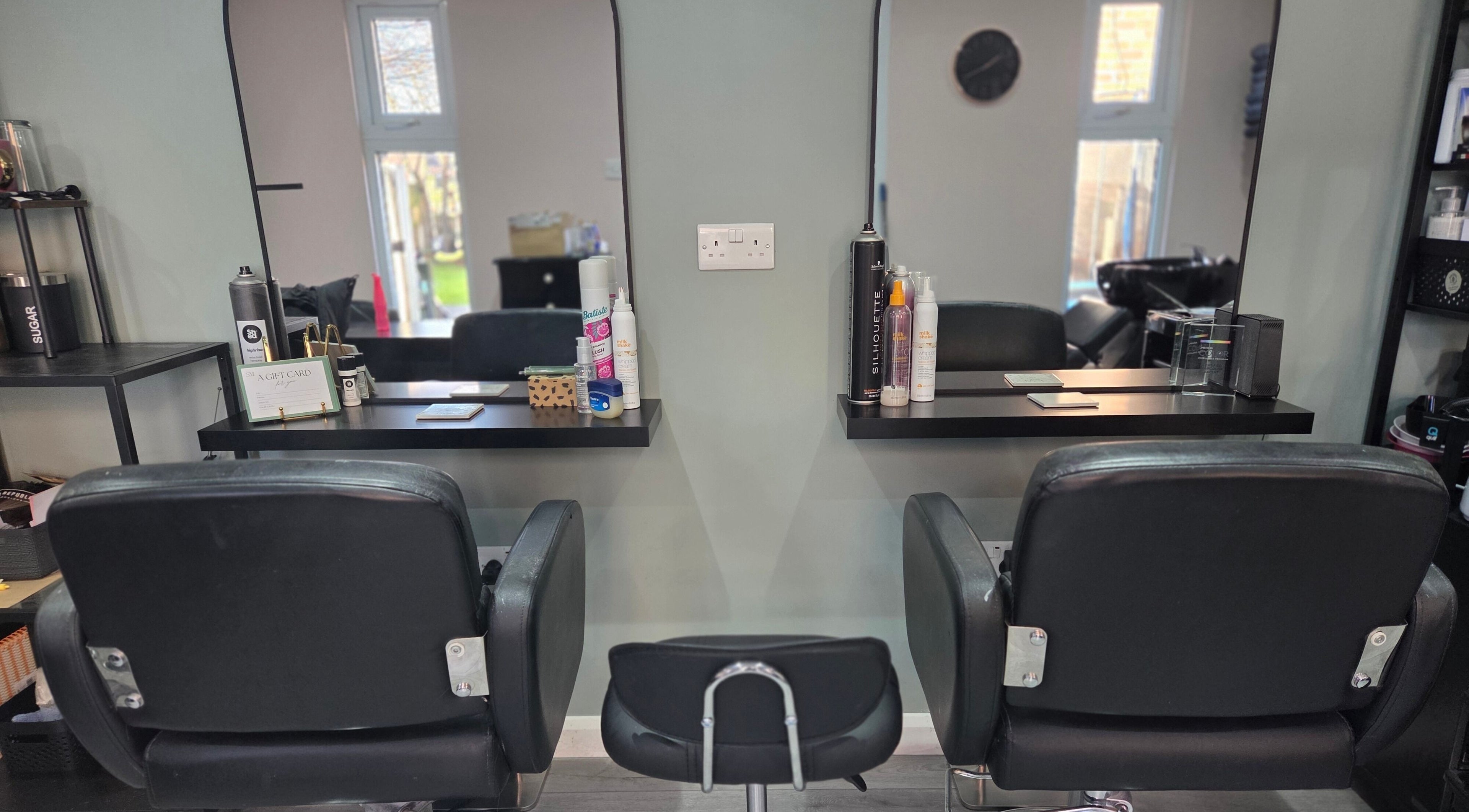 Stylish hairdressing stations at SM Hair in Hindley, England, GB offer modern comfort and elegance.