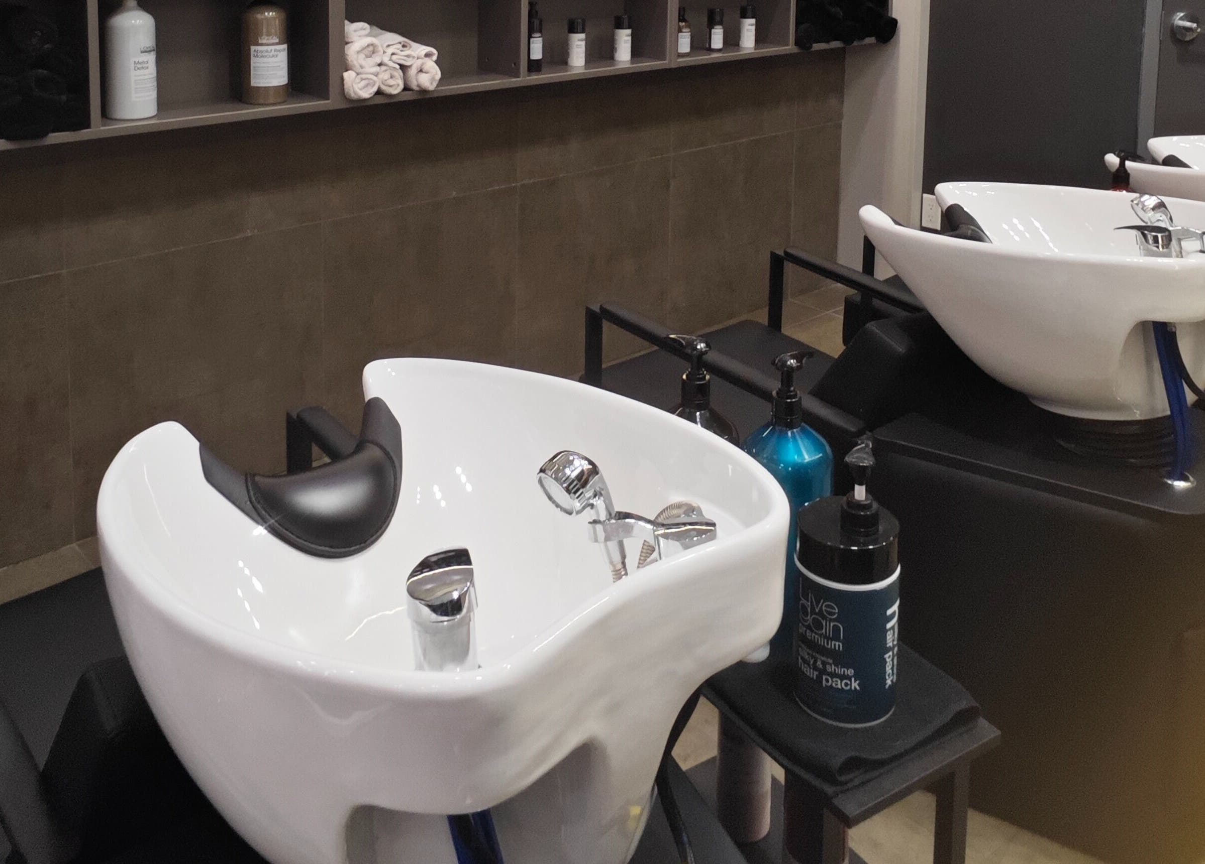 Sleek wash stations at Gatsby Studio Salon & Nails in Richmond Hill, Ontario, CA offer a relaxing hair care experience.