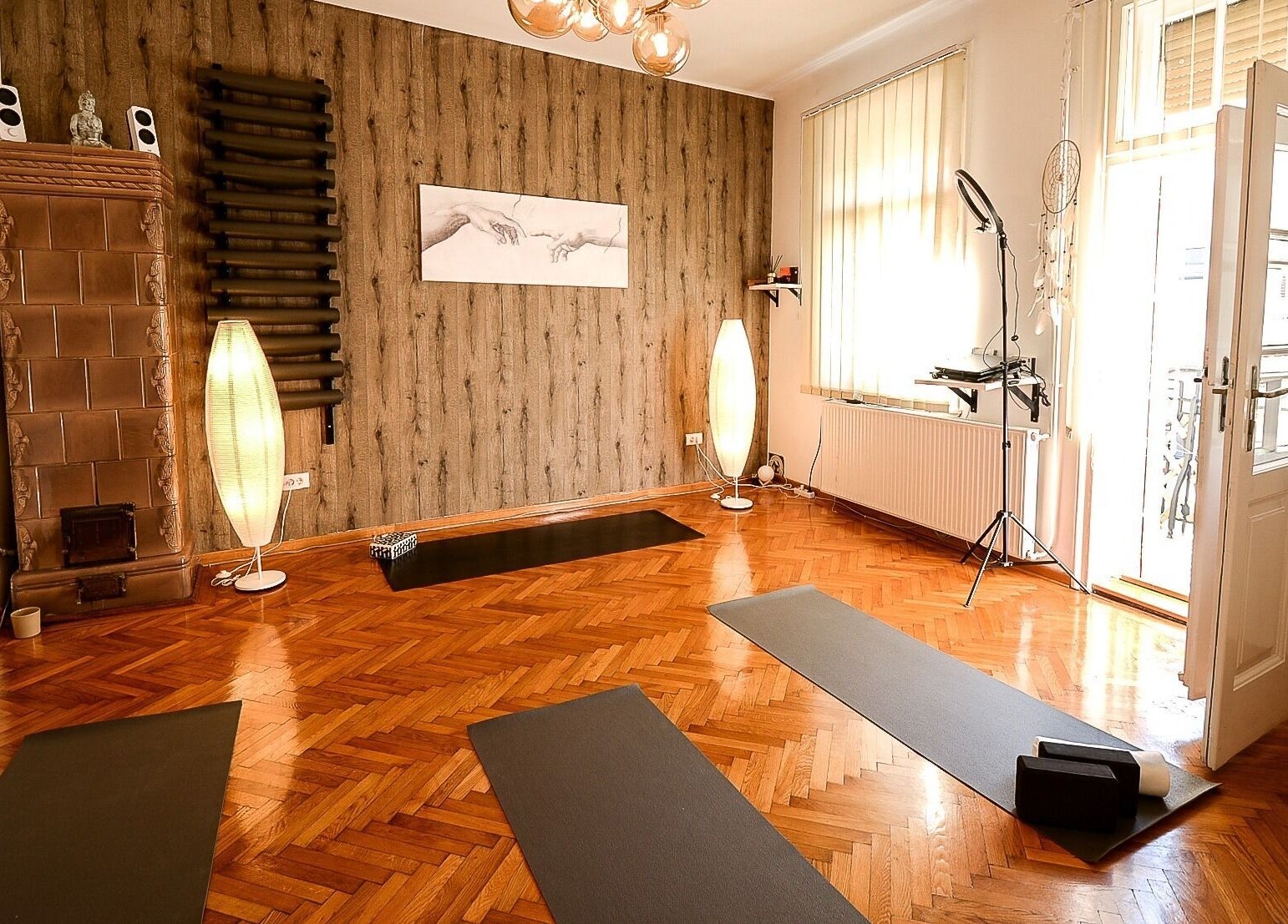Yoga studio at Moon Energy, Beograd, RS, featuring tranquil decor and yoga mats on wooden flooring.