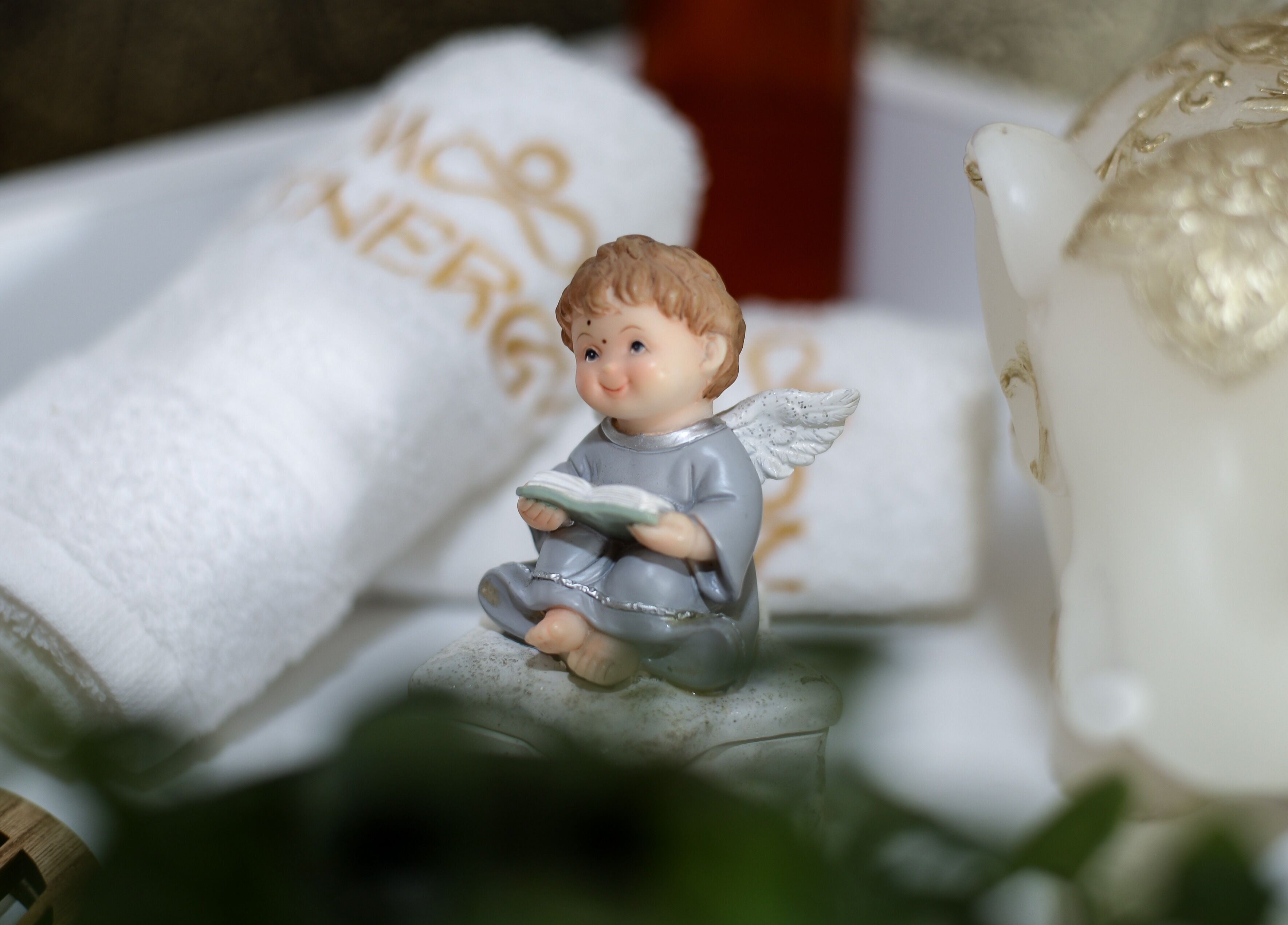 A serene angel statue with Moon Energy towels in Beograd, RS, showcasing tranquility and elegance.