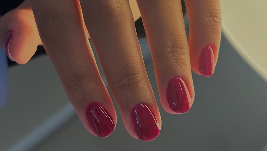 Perfect manicure with red nails at Pamira Nails, London, England, GB, showcasing sleek and glossy finish.