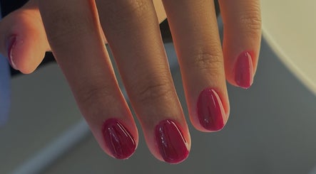 Perfect manicure with red nails at Pamira Nails, London, England, GB, showcasing sleek and glossy finish.