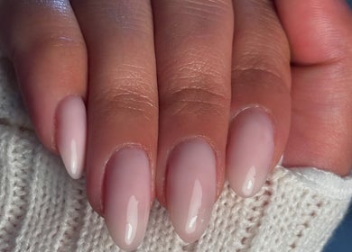 Close-up of elegant manicure at Pamira Nails, London, England, GB, showcasing soft pink polished nails.