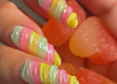 Bright, rainbow nail art at Pamira Nails, London, England, GB, featuring vibrant candy-like designs.