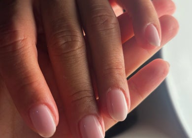Elegant manicure at Pamira Nails, London, England, GB, showcasing soft pink polished nails.