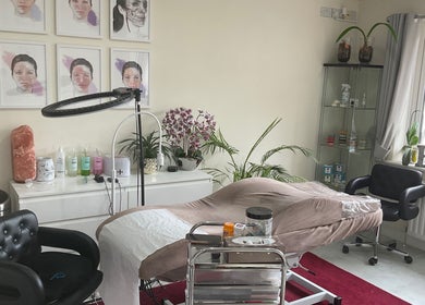 Relaxing treatment room at Elegance Beauty & Aesthetics, March, England, GB, featuring a plush bed and stylish decor.