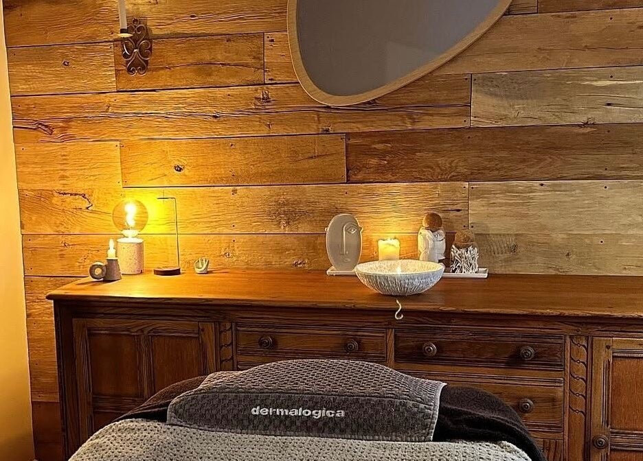 Warm, inviting spa room interior at Meraki Skincare Aesthetics Education, Bristol, England, GB, featuring wood accents.