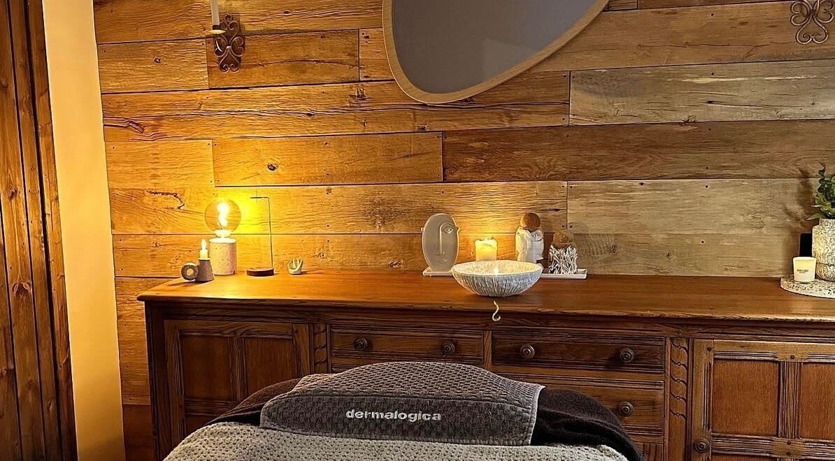Warm, inviting spa room interior at Meraki Skincare Aesthetics Education, Bristol, England, GB, featuring wood accents.