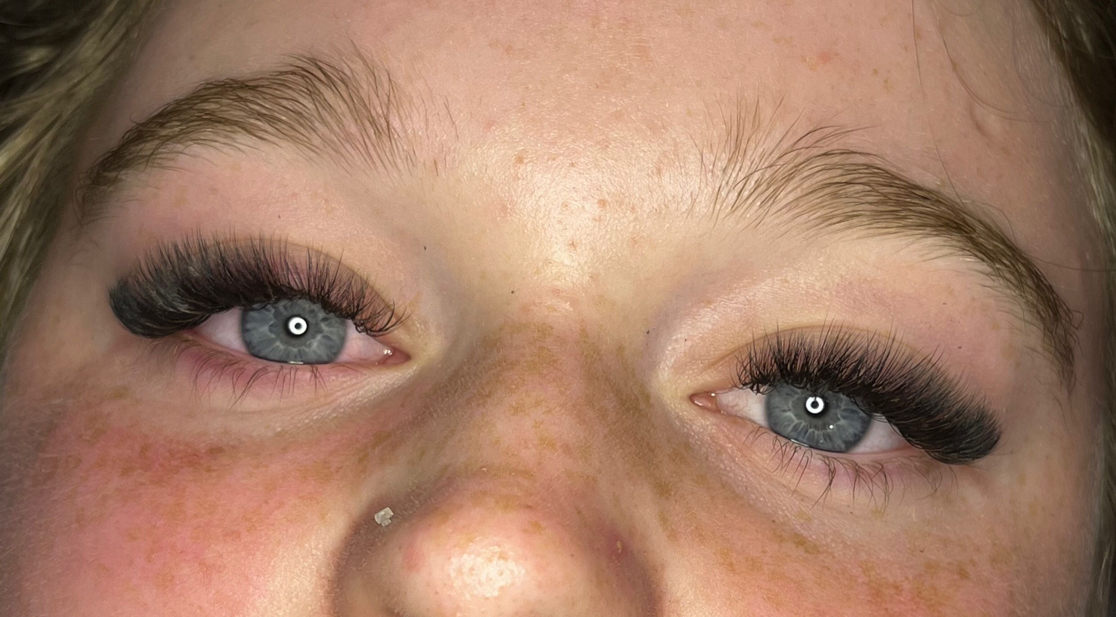 Closeup of eyelash extensions by Lashes by Lydia in Pickering, England, GB, showcasing detailed lash craftsmanship.