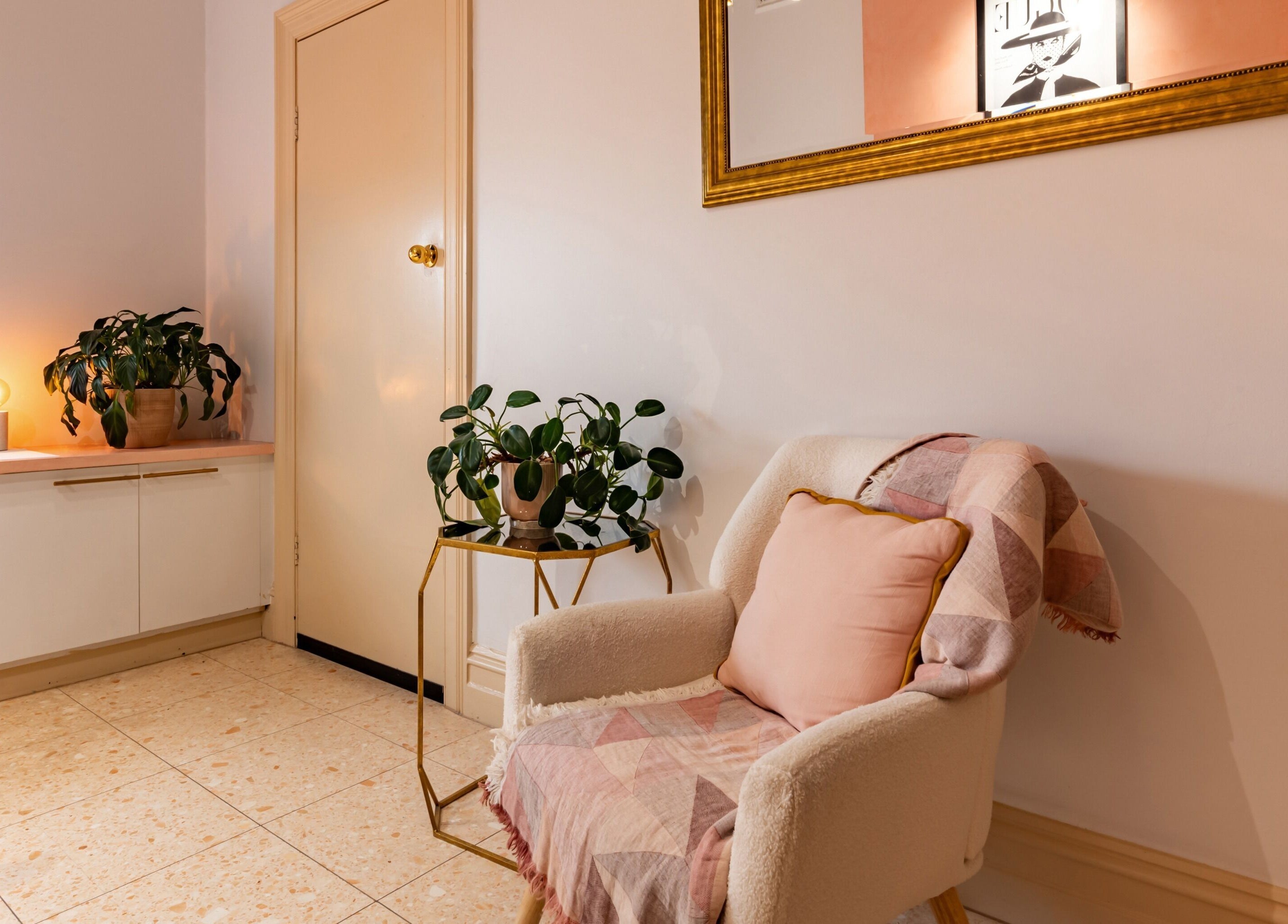 Inviting seating area at Me Skin and Body, Melbourne, Victoria, AU, featuring plush armchair and potted plants.