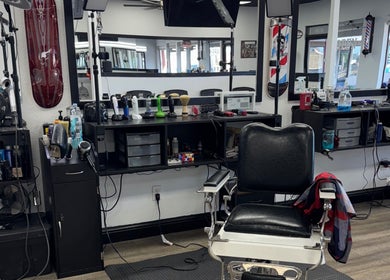 Modern barber chair at Ruben Carreon, Yuba City, California, US. Equipped with grooming tools for stylish haircuts.