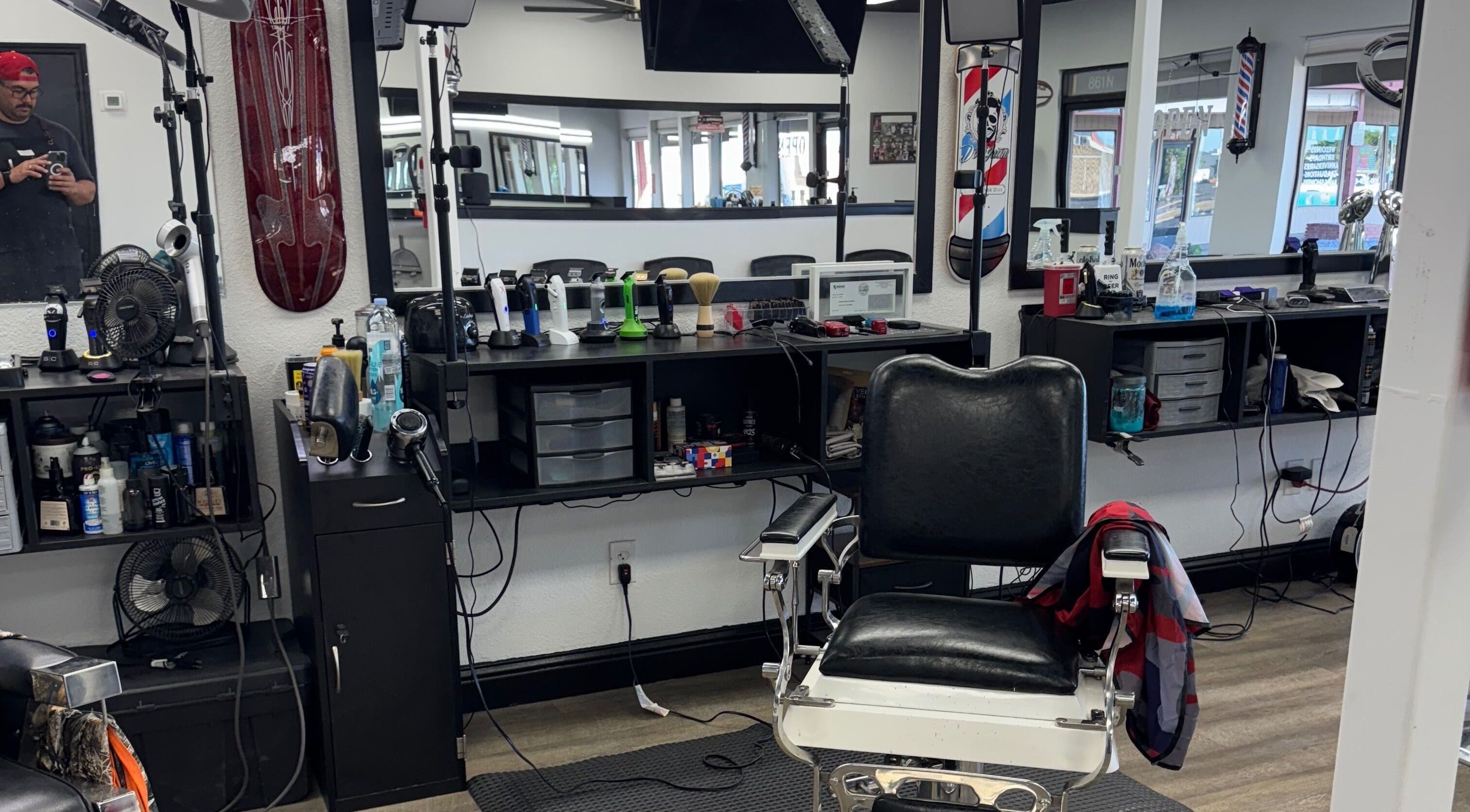 Modern barber chair at Ruben Carreon, Yuba City, California, US. Equipped with grooming tools for stylish haircuts.