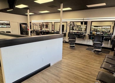 Modern barber chairs and mirrors at Ruben Carreon in Yuba City, California, US showcasing a stylish interior.