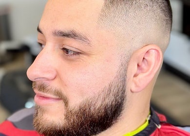 A man with a fresh haircut at Ruben Carreon in Yuba City, California, US, showcasing expert grooming.