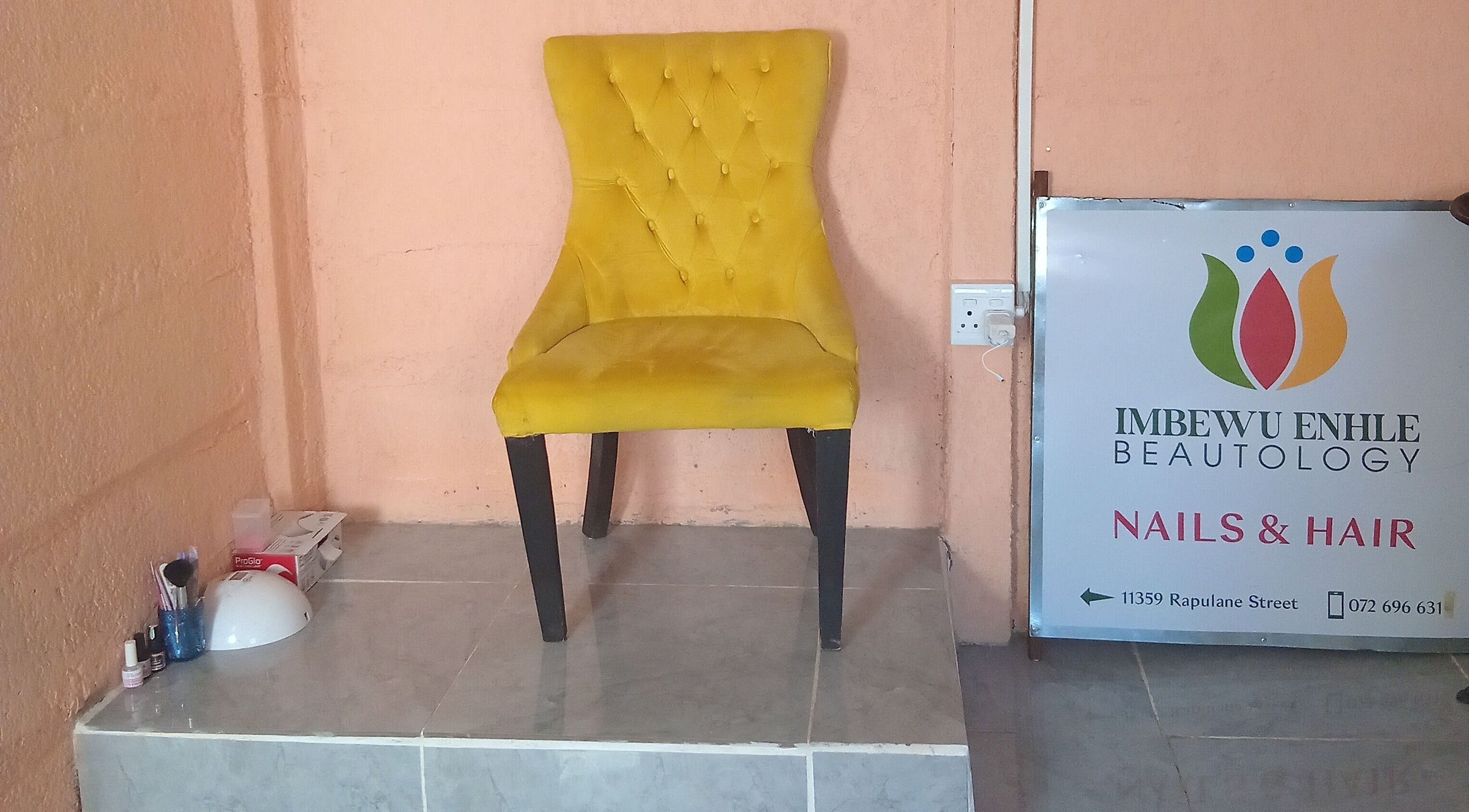 Yellow chair at Imbewuenhle Beautology, Benoni, Gauteng, ZA, showcasing a chic ambience.