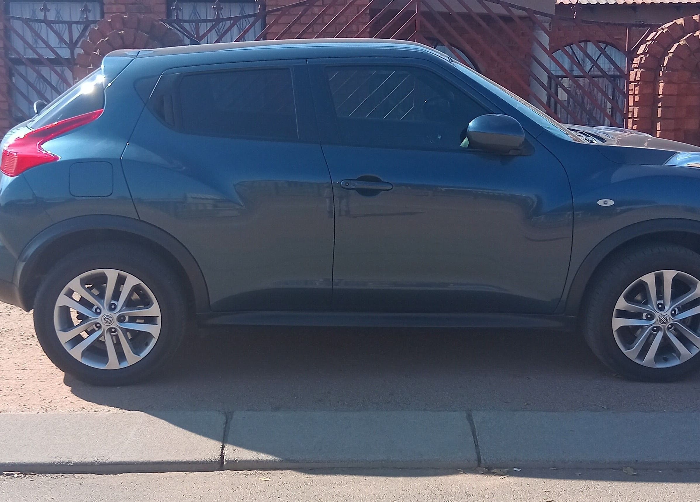 Imbewuenhle Beautology at Benoni, Gauteng, ZA with a sleek, parked car on a sunny day.