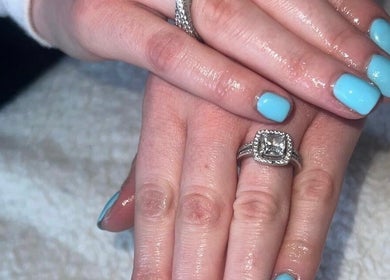 Gleaming blue nails with rings at RDHNails, Birmingham, England, GB showcasing modern manicure artistry.