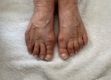 Close-up of feet on soft towel at RDHNails, Birmingham, England, GB, highlighting natural pedicure services.