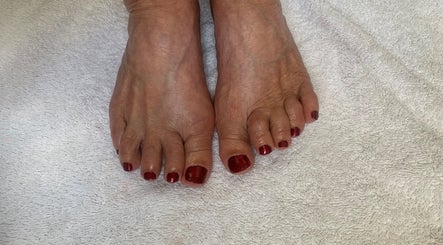 Elegant pedicure with red polish at RDHNails, Birmingham, England, GB, showcasing professional nail care.