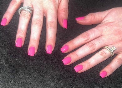Bright pink manicured nails at RDHNails, Birmingham, England, GB showcase elegance and style.