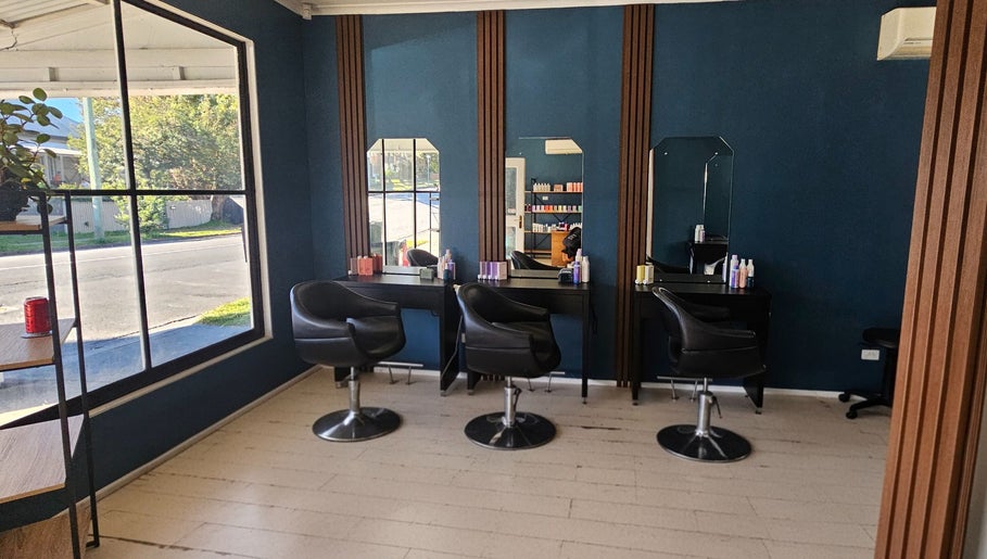 Chic salon interior at Indie Hair, Windsor, Queensland, AU with stylish chairs and mirrors.