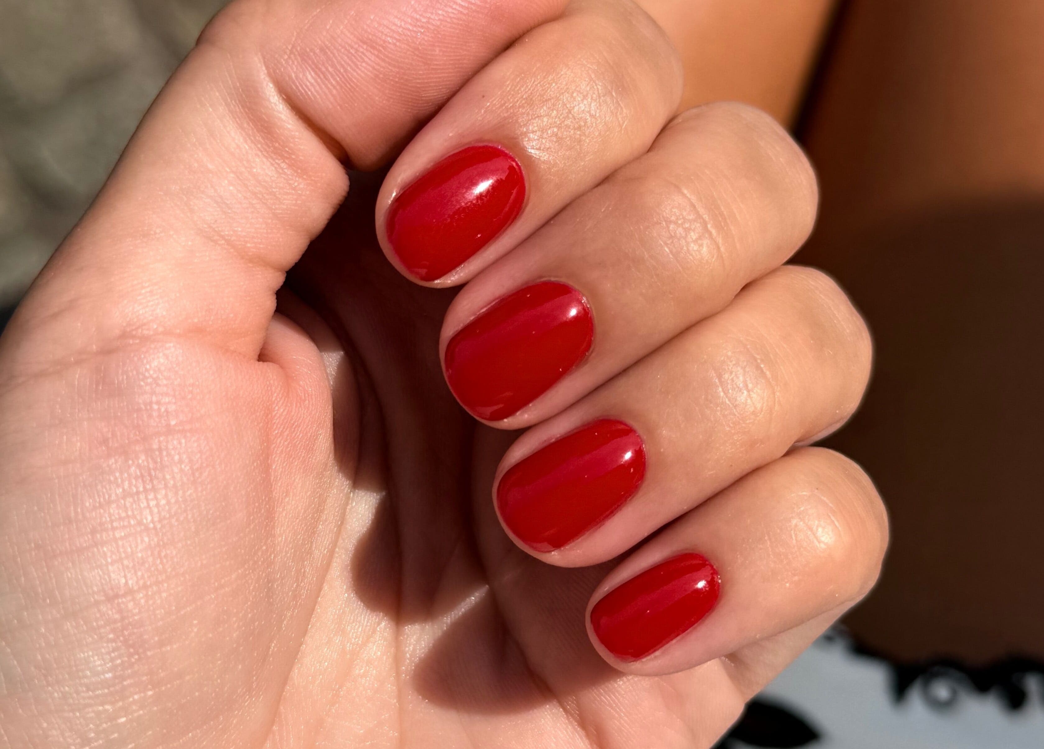 Vibrant red manicure at Juss.nail, Amsterdam, Noord-Holland, NL showcasing expert nail care.