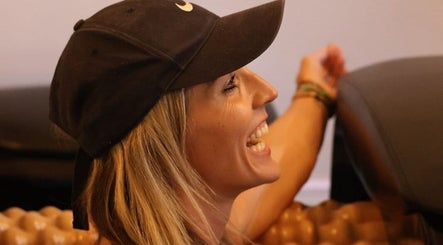 Smiling guest enjoying relaxation at Innermost Wellbeing in Cape Town, Western Cape, ZA.