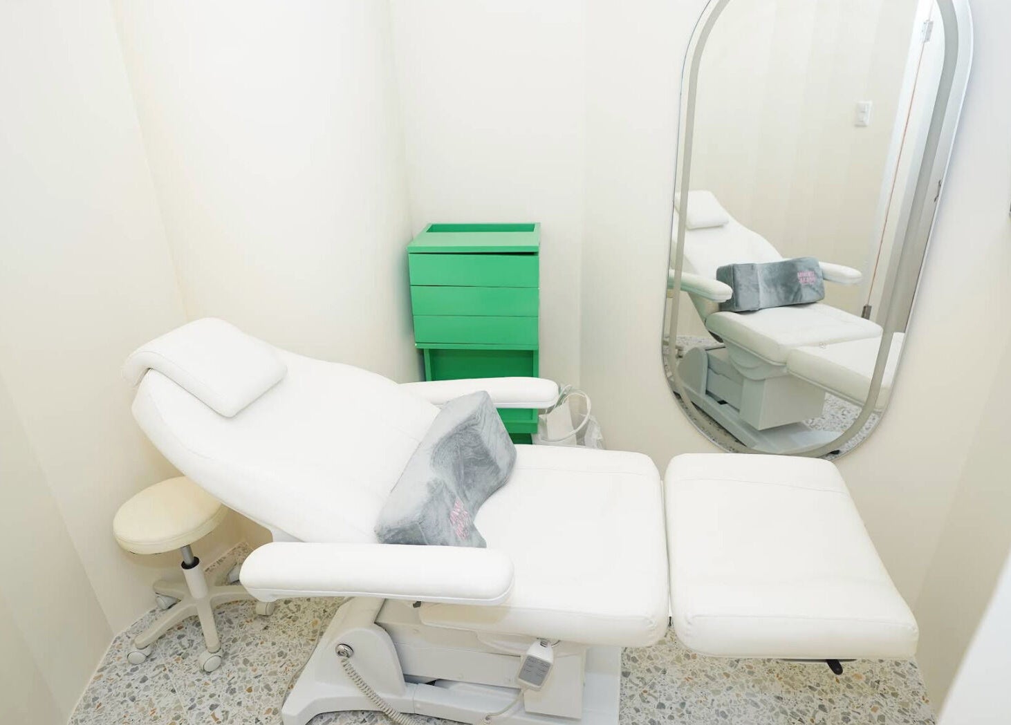 Comfortable treatment room at Lunch Break Beauty, Makati, Metro Manila, PH with a white reclining chair and mirror.