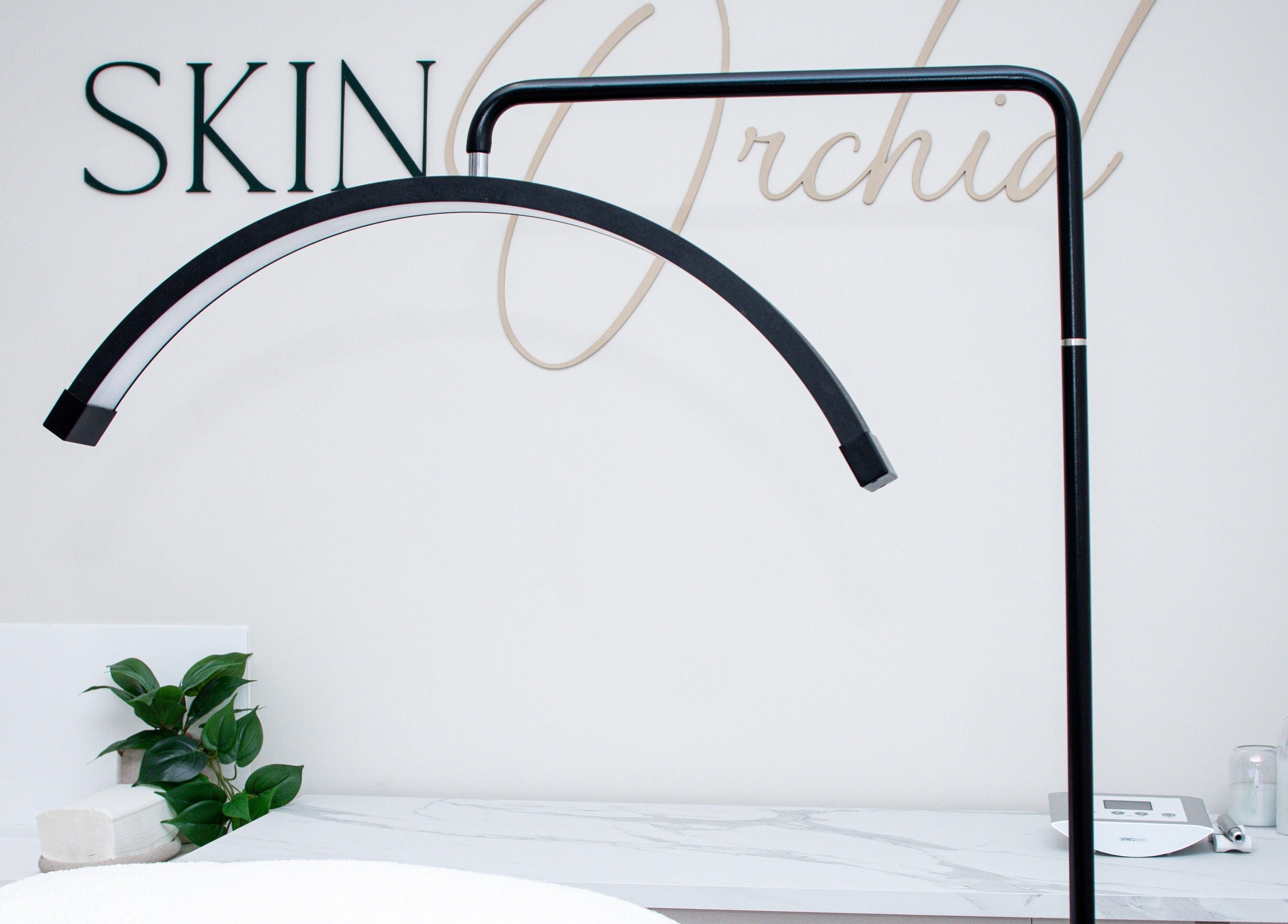 Sleek modern treatment area at Skin Orchid, London, England, GB, featuring spa essentials and a serene ambiance.