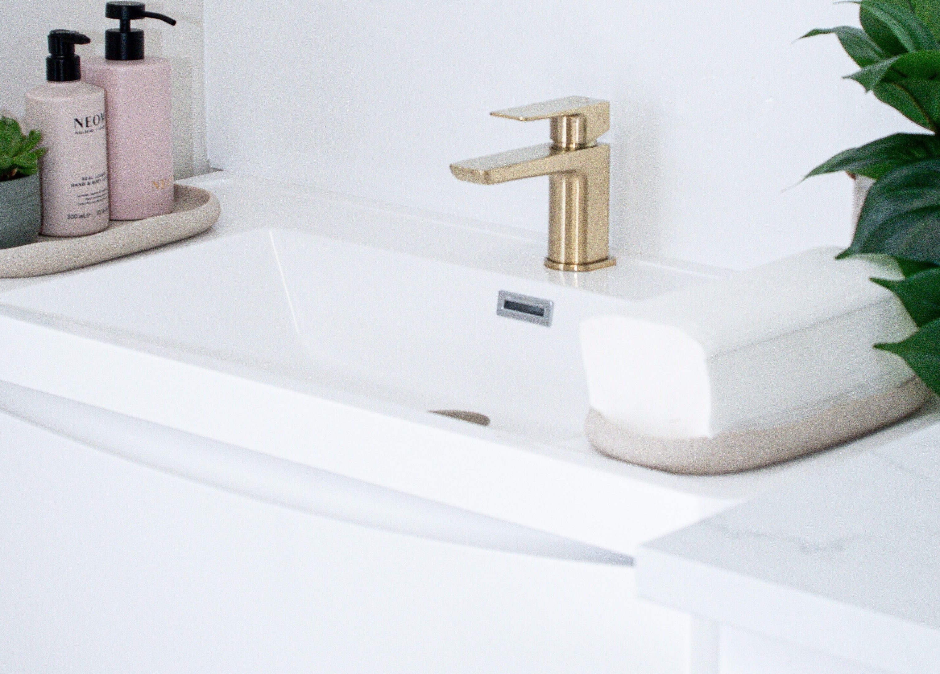 Luxurious Skin Orchid bathroom with gold faucet in London, England, GB.