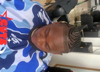 Expert barber styling hair at Icons Barbershop, Kingston, St. Andrew Parish, JM.