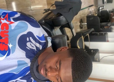 Professional haircut at Icons Barbershop, Kingston, St. Andrew Parish, JM showing a trendy fade style.