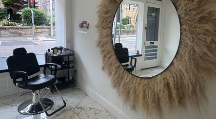 Modern salon chair at The Brow & Lash Lab ByElle, Edinburgh, Scotland, GB with stylish decor.